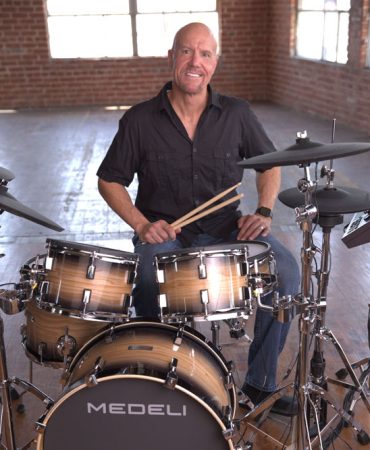 Steve Fisher playing a Medeli Drum Kit